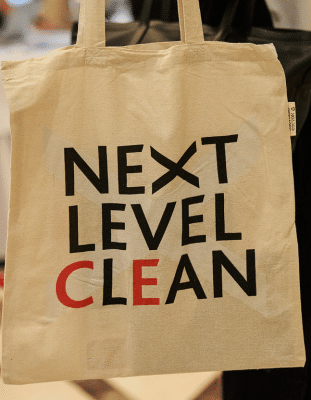 The words Next Level Clean printed onto a eco-friendly bag.
