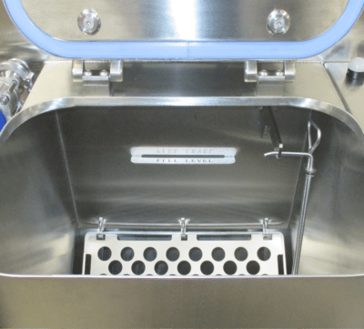 Internal view of PBSC HC-DT dunk tank showing empty chamber, fill level indicator and internal spray components for controlled cleaning and decontamination