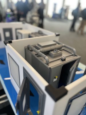 The PBSC display at EBSA 2025, showing a focused view of a model of a decontamination facility, available at PBSC.