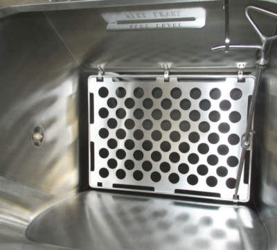 Close up of perforated drainage plate inside PBSC HC-DT dunk tank supporting controlled liquid flow and containment integrity during empty operation